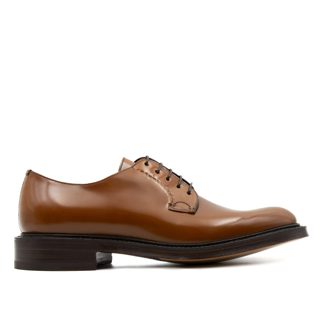 Scarpa stringata da uomo in pelle di vitello tabacco e suola in cuoio di bufalo.